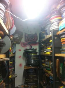One of the film rooms at the A/V Geeks archive, complete with a former boarder's rose mural. 