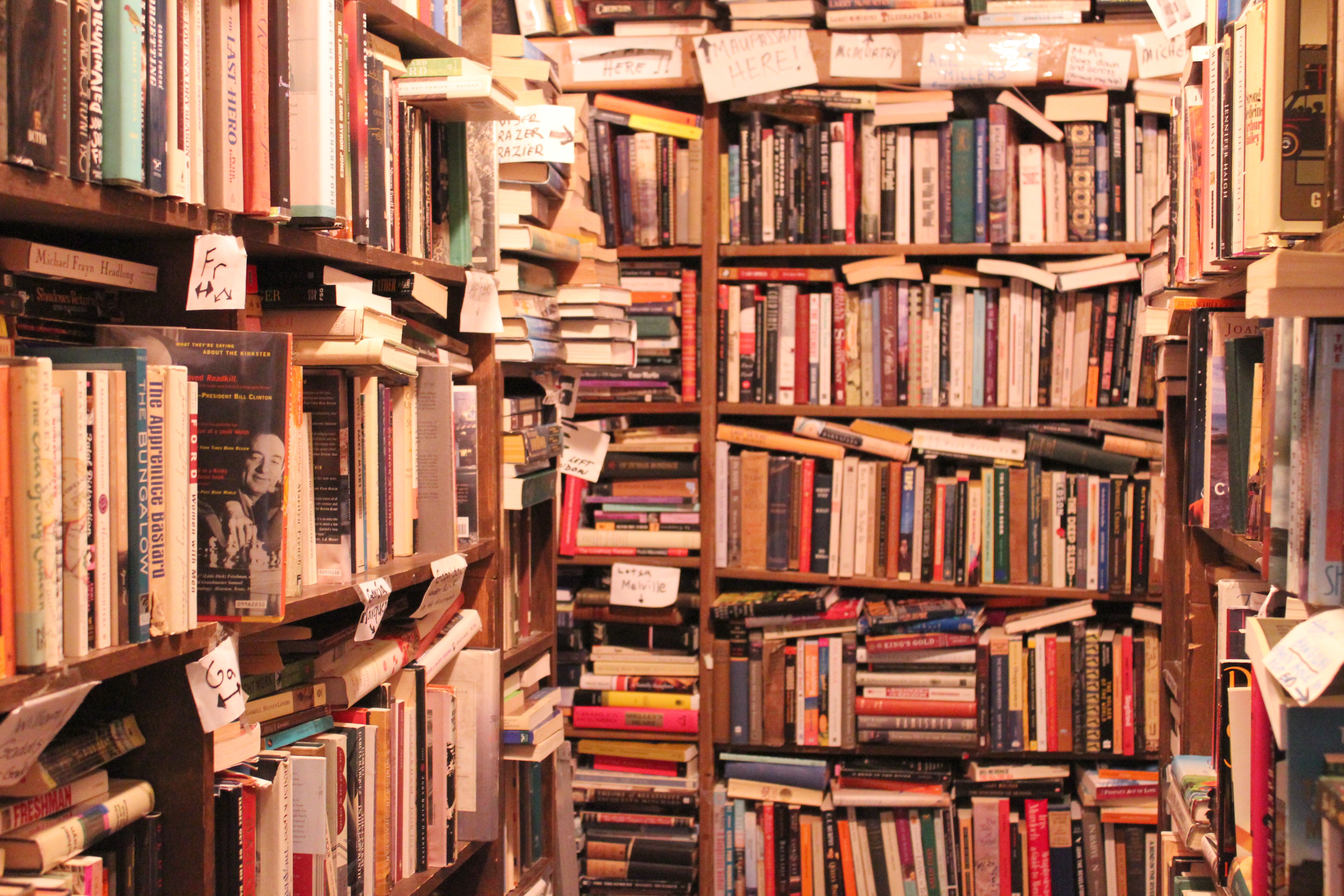disorderly, overstuffed bookstore shelves