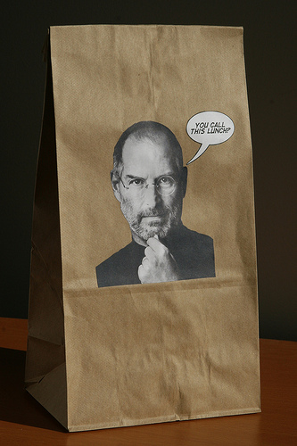 brown bag with Steve Jobs' photo on it