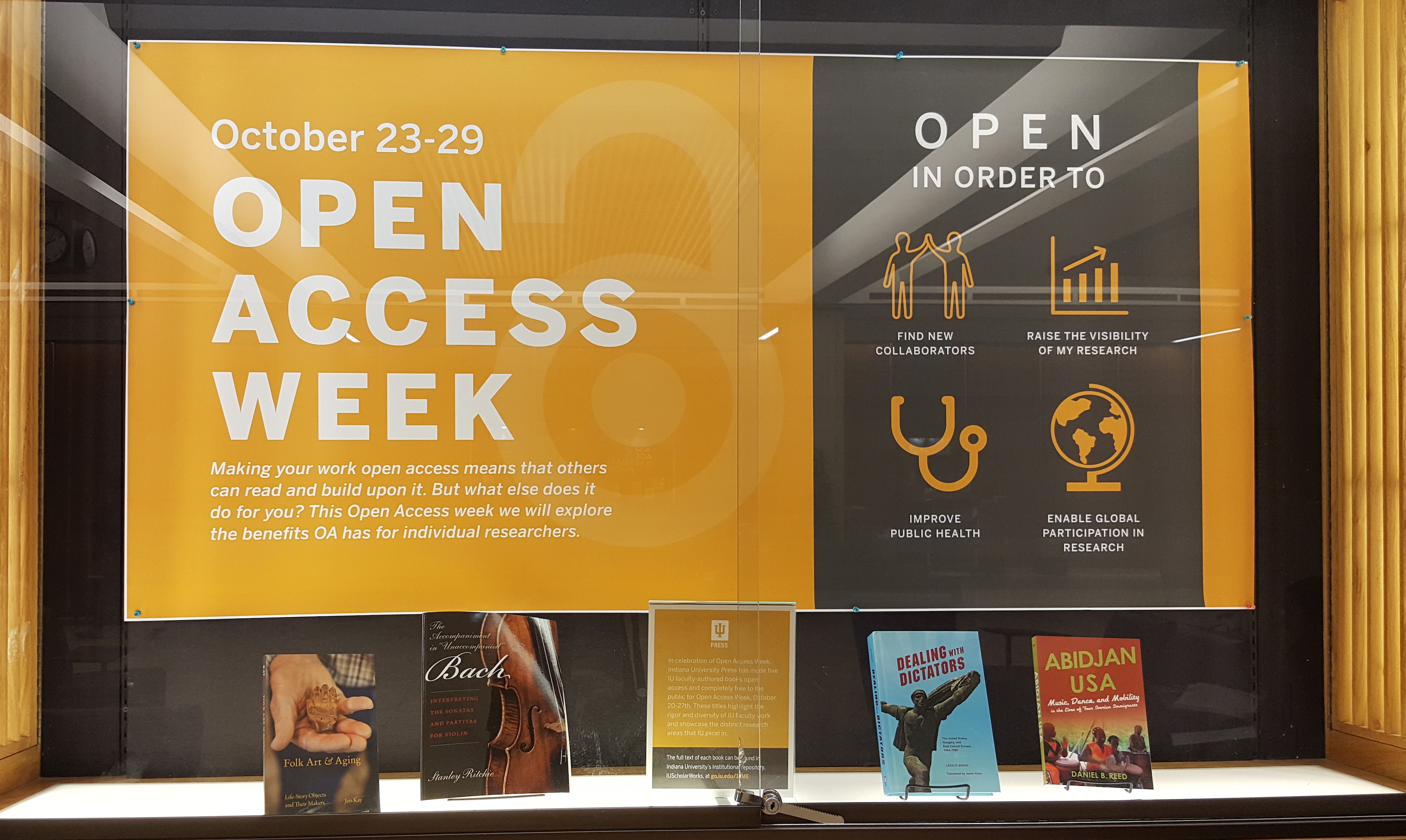 OA week display case with open press books
