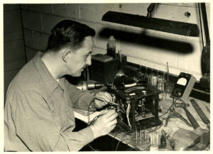 Robert F. Borkenstein working on his Breathalyzer Prototype, invented in 1954.