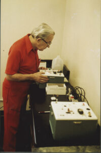 Borkenstein examining a Breathalyzer Model 900B, manufactured by the Drager Corporation, circa 1985-1995.