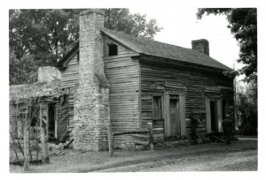  Black and white photograph of a 19th century farm house. 