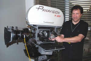 Everett with Panavision 65mm Camera and holding an Eric Berndt 3mm Camera (image courtesy of AMPAS Sci-Tech Council Historical Subcommittee)