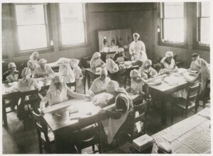 Women at work in the Red Cross Workshop; photo from the 1918 Arbutus