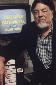  Color photograph of a man in front of a tv set.