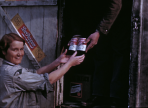 Still from You Can't Eat Tobacco. Canned milk is purchased from the "rolling store."