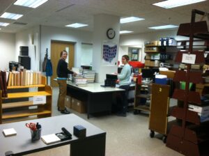 Unpacking the first bindery delivered to Bindery Prep's new Preservation Lab location.
