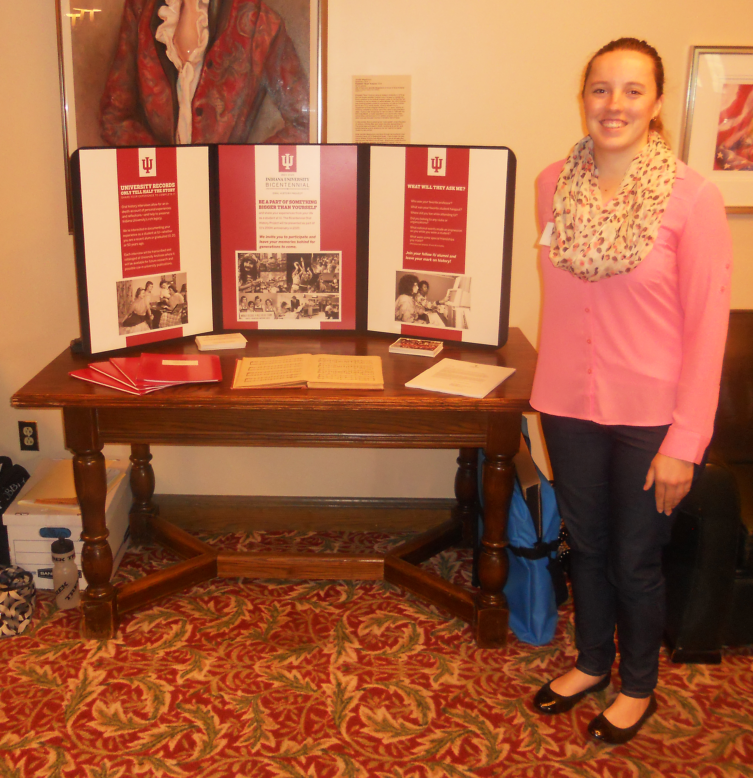 Katie manning the Oral History booth at Cream & Crimson Weekend.