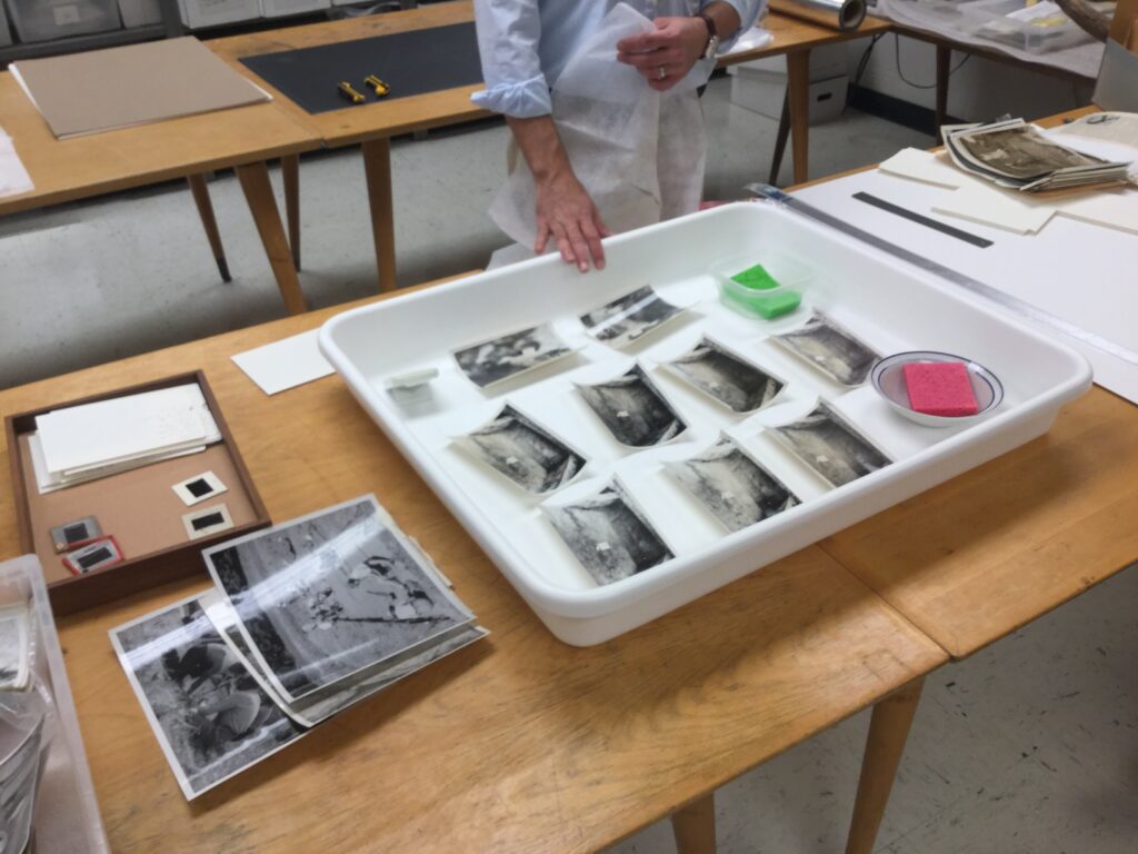 Teaching humidification and pressing of photographs to Archaeology students and staff