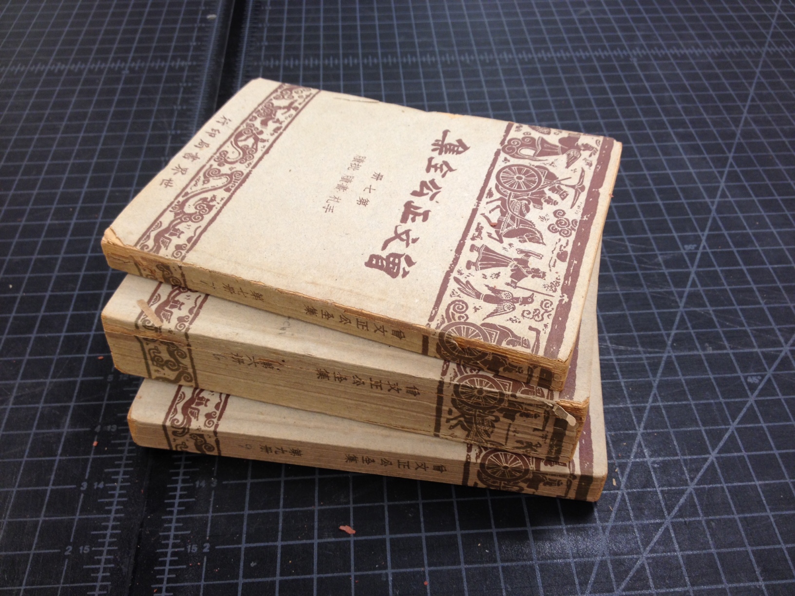 A set of Chinese books that are disintegrating due to acidic paper.