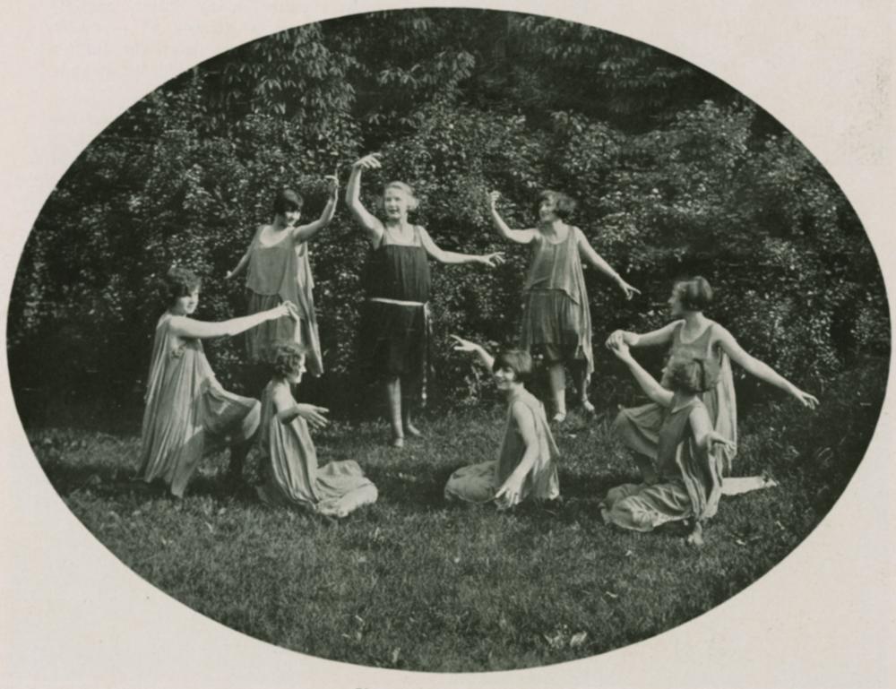 A scene from the 1924 May Festival, IU Archives photograph. Eight women dance in a field.