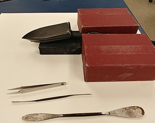 tacking iron, tweezer , and micro spatula displayed
