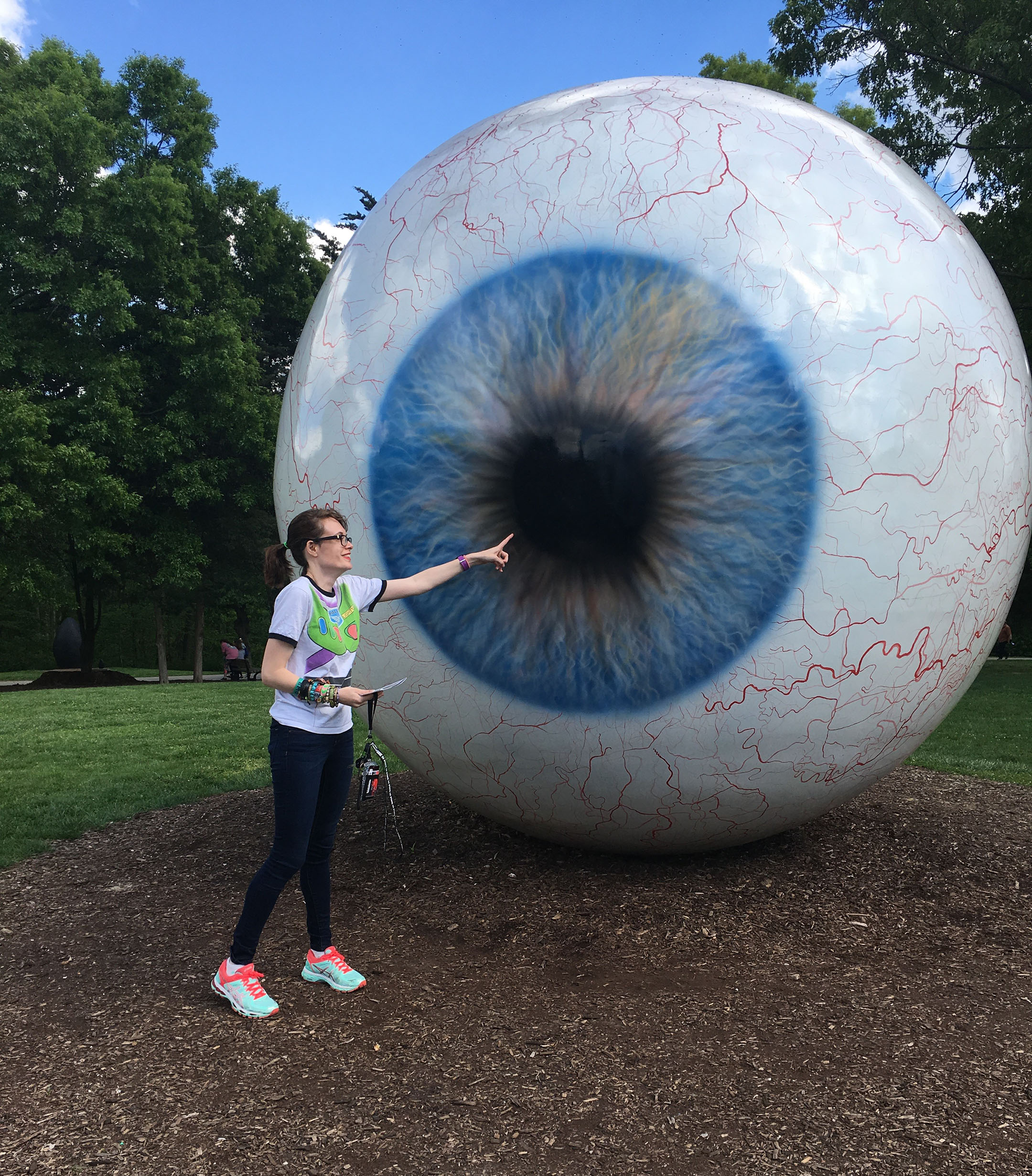 Rebecca Jacobs appears to touch the sculpture, Eye