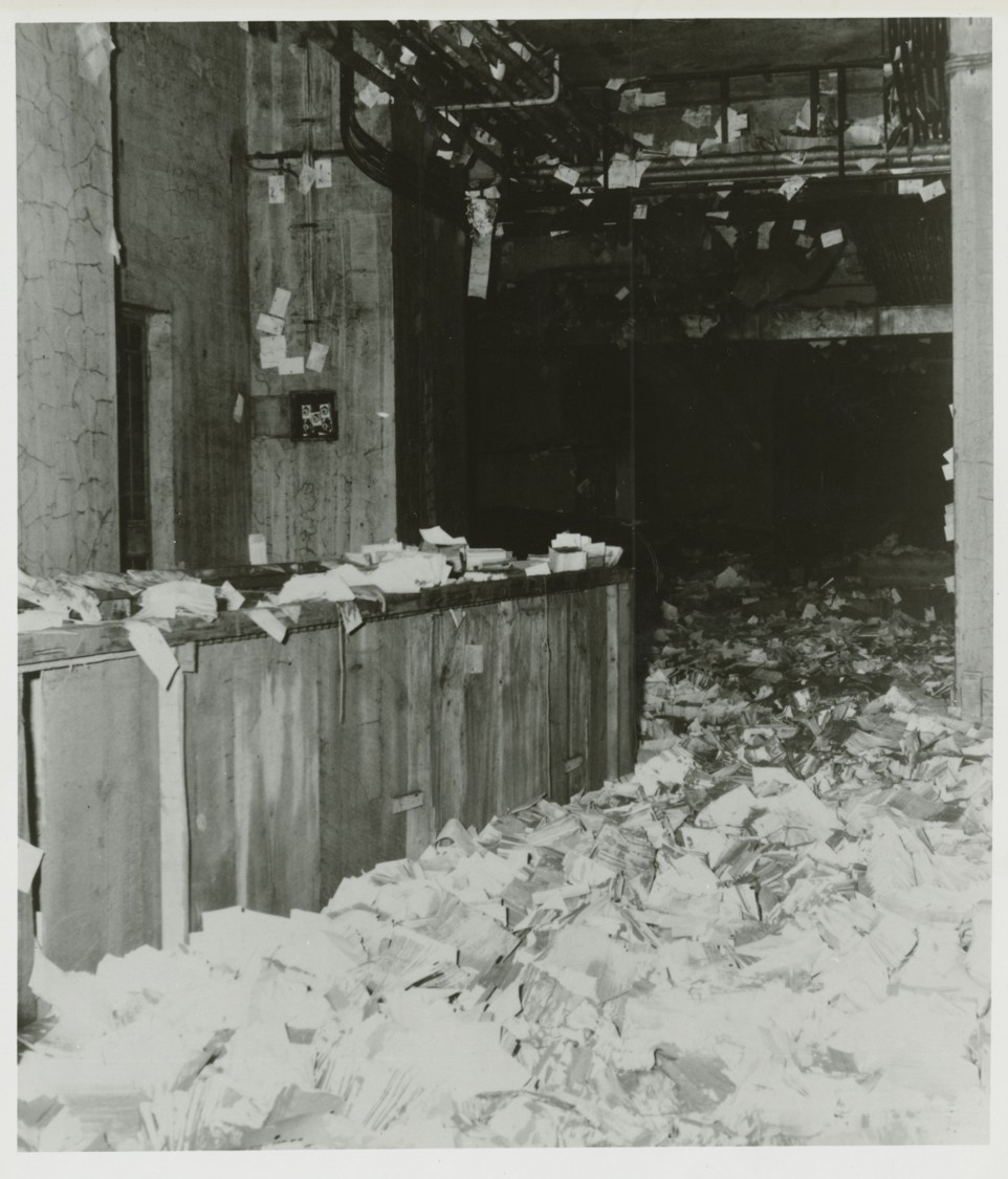 Black and white photograph of damaged books.