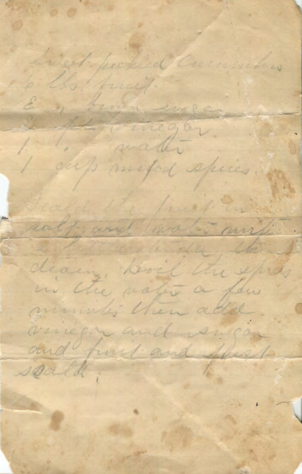 Hand-written note with a recipe for pickled cucumbers.