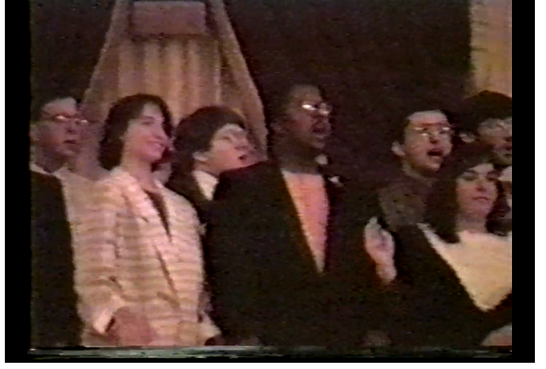 Attendees at APO gathering in Boston sing the organization's song, 1985. 