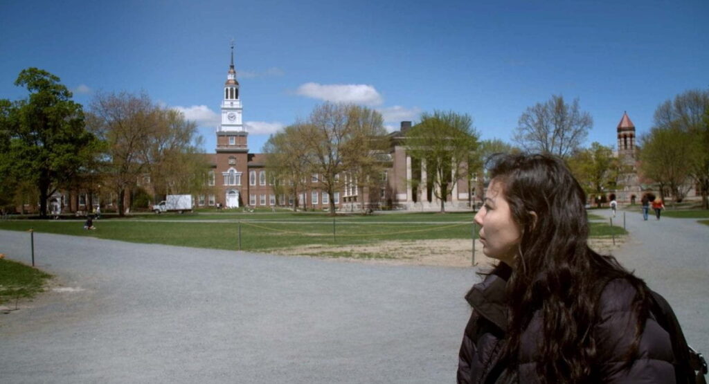 Melissa Padilla stands before the Baker-Berry Library at Dartmouth College.