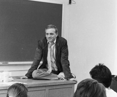Howard Ashman sitting on desk during 1987 campus visit