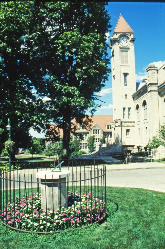 Color photograph of a sundial in front of the IU Student Building. 