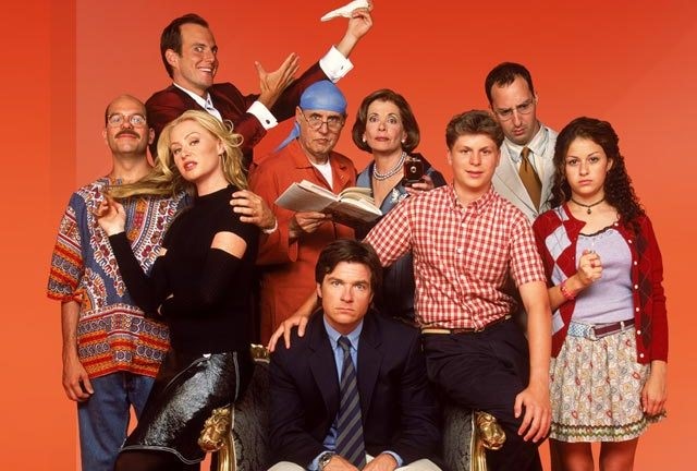 still image from the tv series, Arrested Development, two female adults, one female teenager, six males