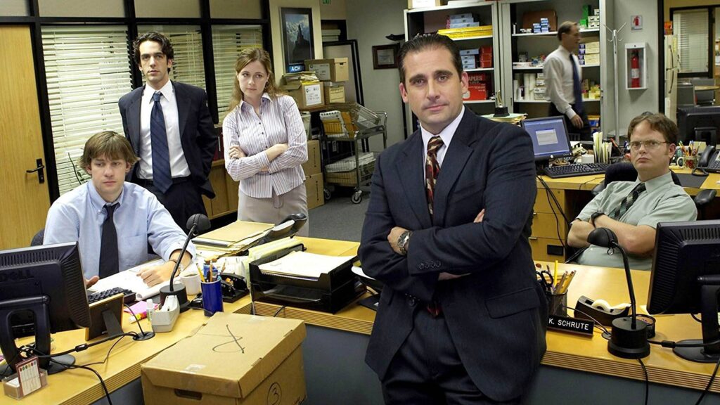 still image of cast from the tv series, The Office, one female, five males
