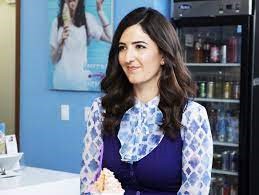 Screencap of D’Arcy Beth Carden as Janet from the tv series, The Good Place