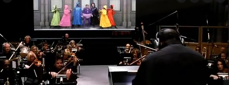 photo image of orchestra with theatre actors