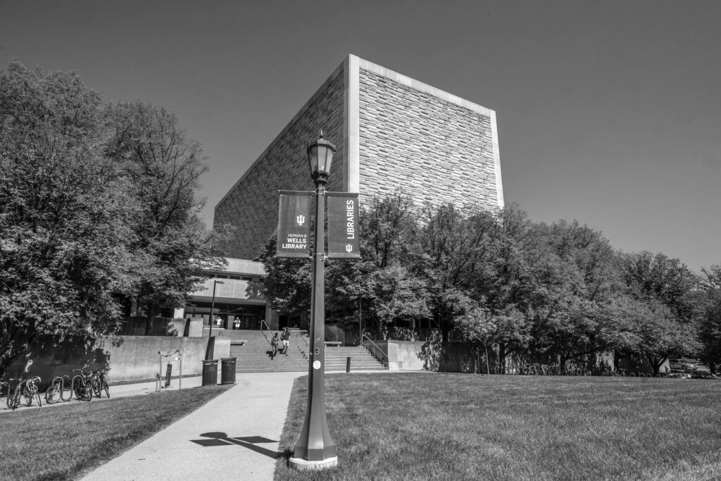 Black and white image of the Wells Library south entrance.