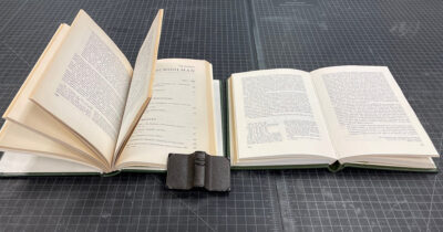 Two 1980s era volumes of a journal, opened.