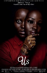 DVD cover art for the film "Us." A woman in a deep red top is pictured, wide-eyed, against a black background. She is holding a mask of her own face slightly to the side of her face. The film title appears in white letters below her image.