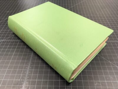 A commercially bound book with a plain buckram cover and stamping on the spine.