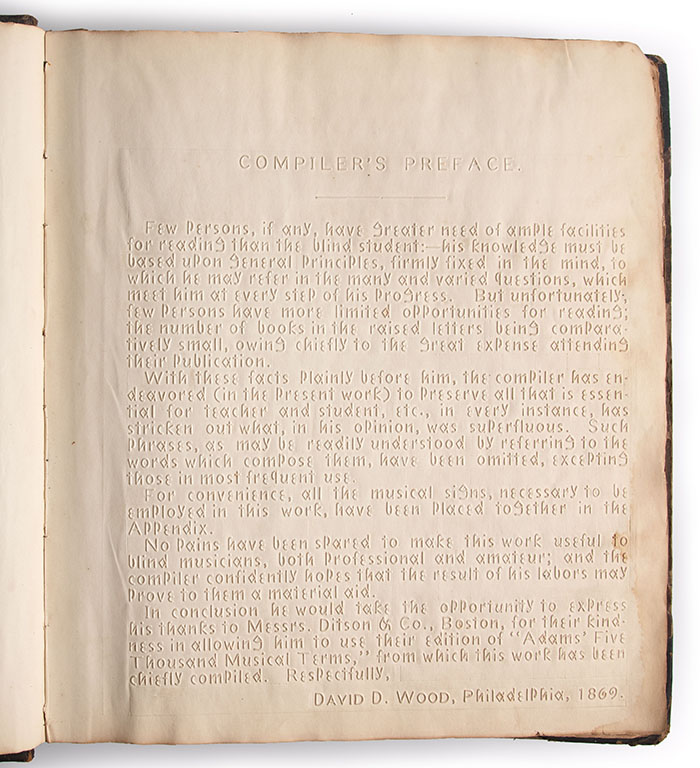 Image of the book's preface with embossed letters.