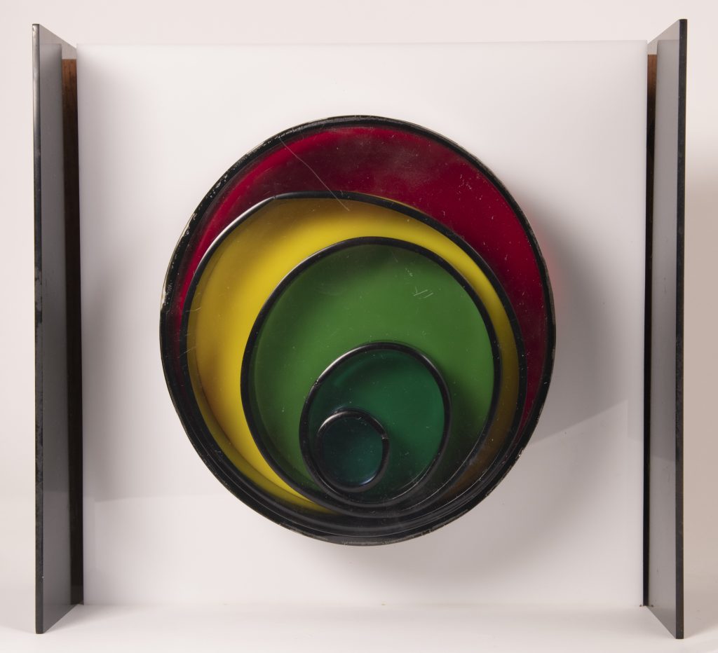 Photo of lamp comprised of concentric circles in red, yellow and green
