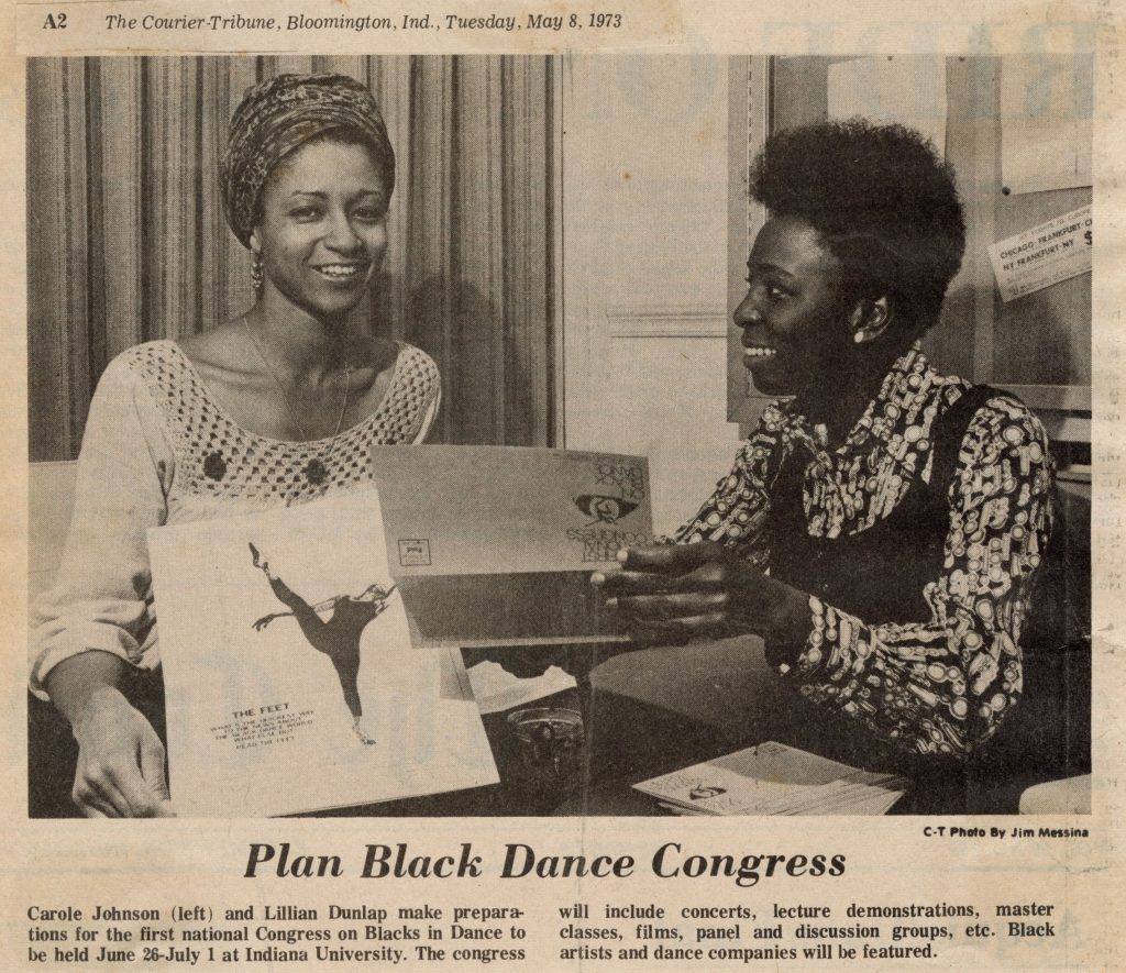 News clipping from The Courier Tribune published on May 8th, 1973 titled "Plan Black Dance Congress." Includes a photo of Carole Y. Johnson, a light-skinned Black woman sitting at a table wearing a head wrap, smiling and holding up a registration form. Seated next to her is Lillian Dunlap, a dark-skinned Black woman with a short afro, smiling and looking at Carole Johnson holding a registration form for their event.