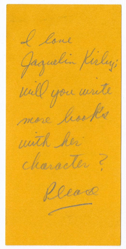 Small yellow stub with the following text handwritten in cursive: “I love Jaquelin Kirby; will you write more books with her character? Please”