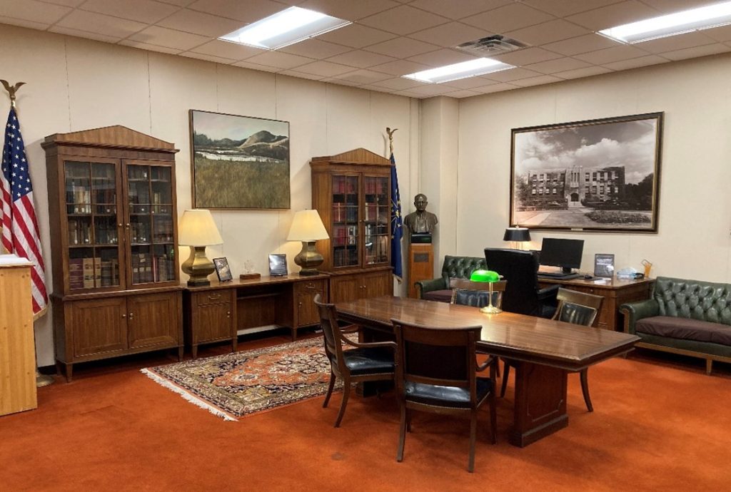 Archives reading room with wooden exhibit cases and tables