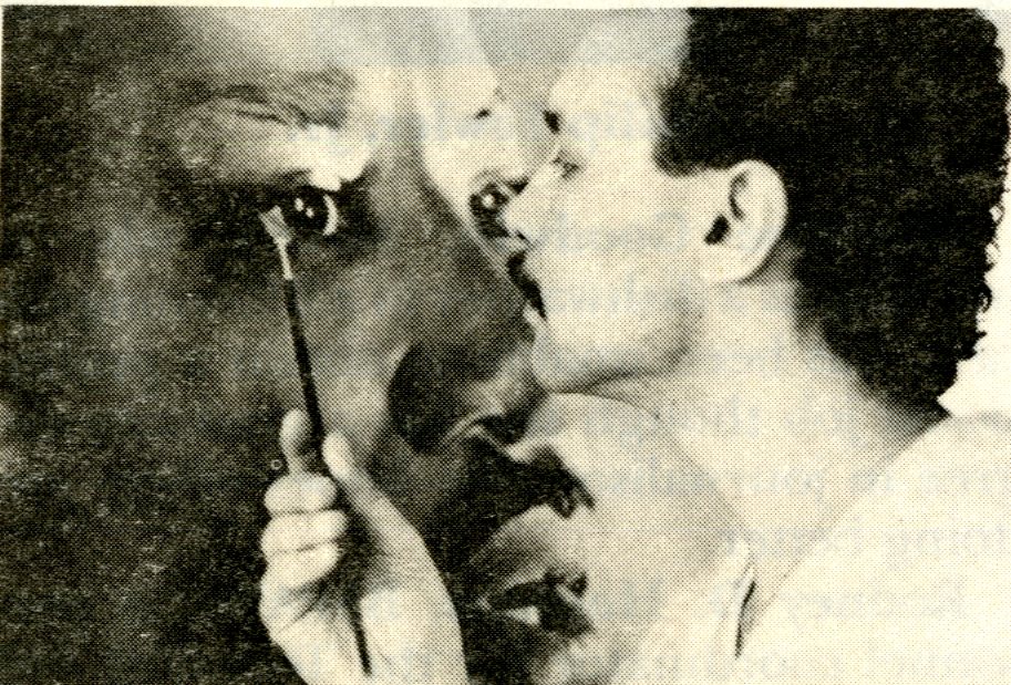 Closeup photo of artist painting eye on MLK, Jr. portrait
